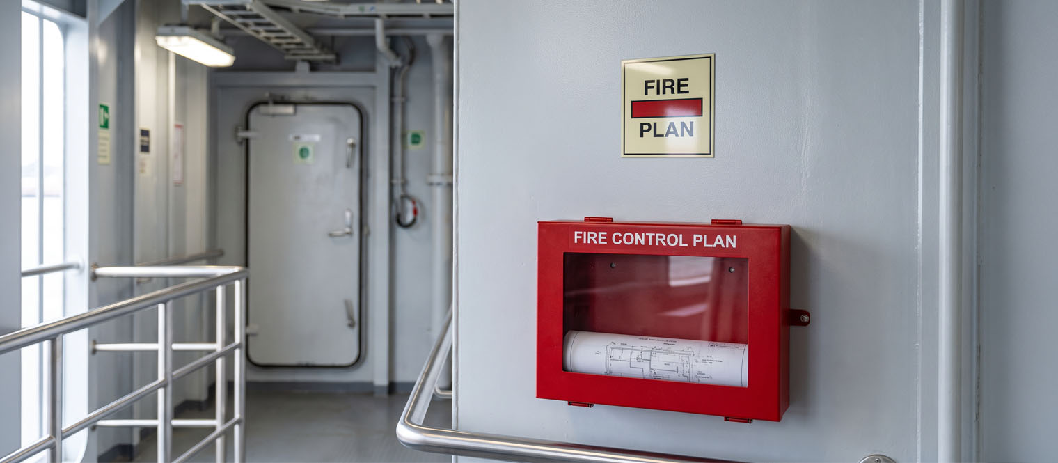 A fire control identification label at a fire pump, damper or remote release station aboard a vessel.
